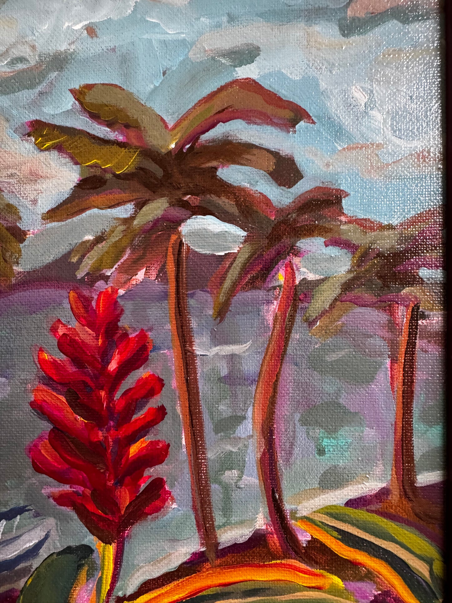 Close-up of a colorful floral painting with vibrant red and yellow flowers.