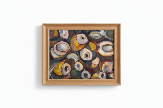 Abstract painting with colorful circular shapes held by a hand.