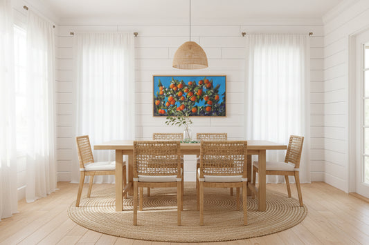 Dining room with wooden table and chairs, colorful abstract painting on the wall.