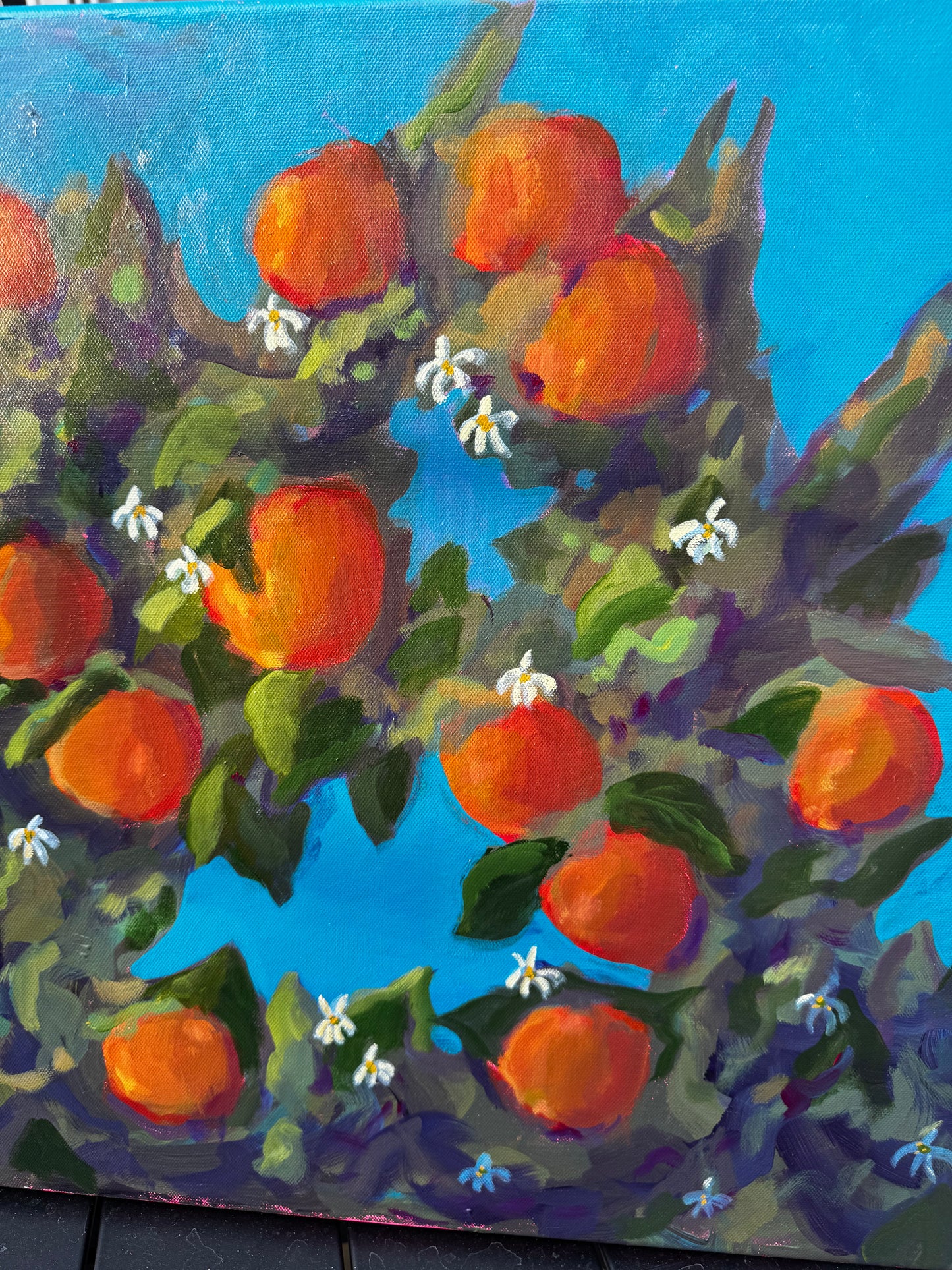 Painting of a branch with orange fruits and green leaves against a blue background