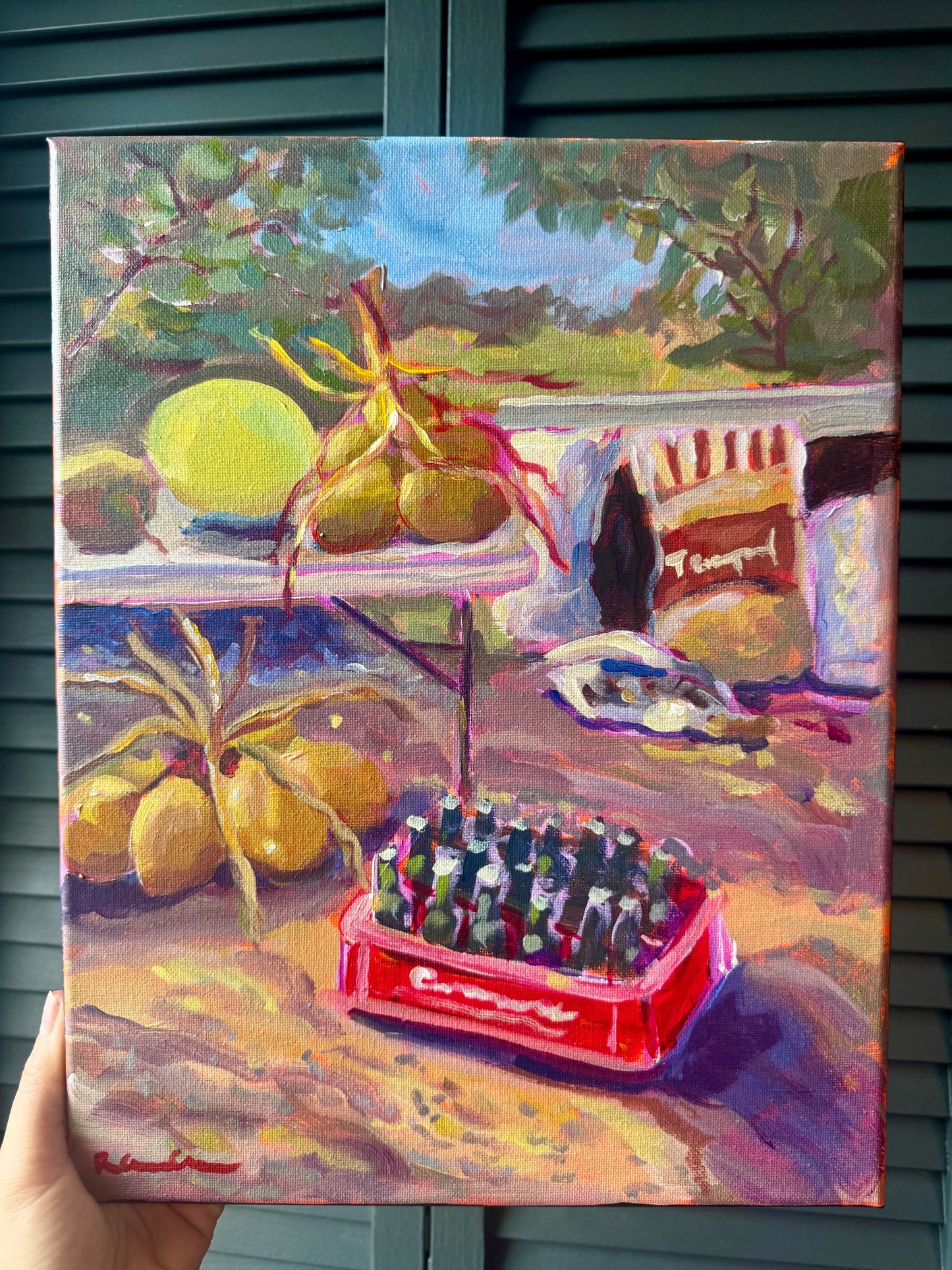 Painting of a still life scene with lemons, a bottle, and a red crate.