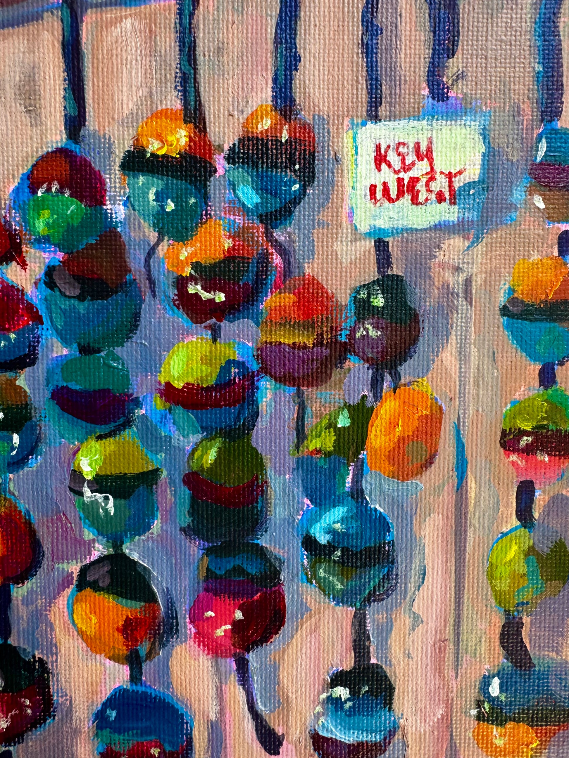 Colorful abstract painting with 'Key West' text on a textured background