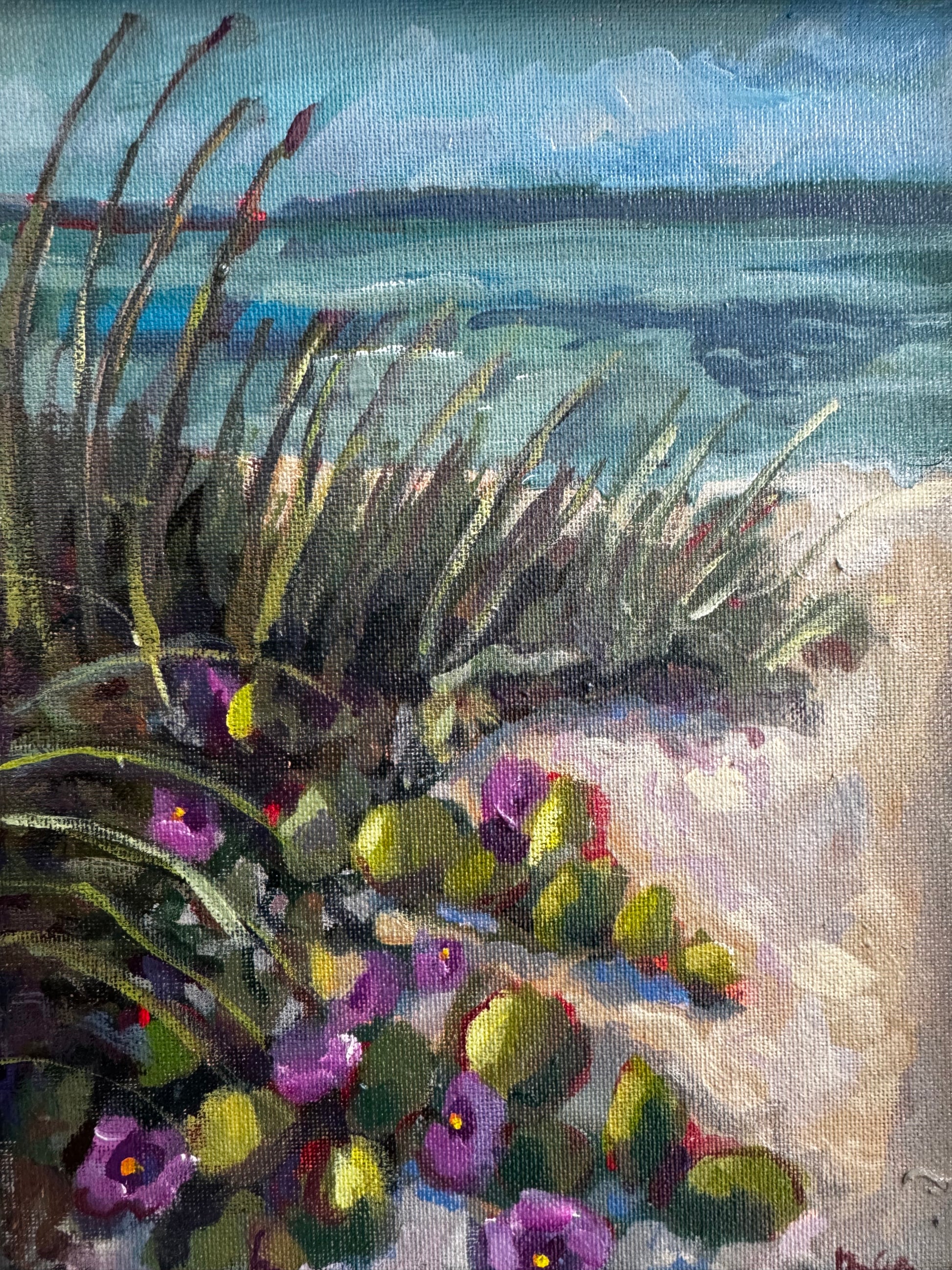Close-up of a painting with flowers and a textured background