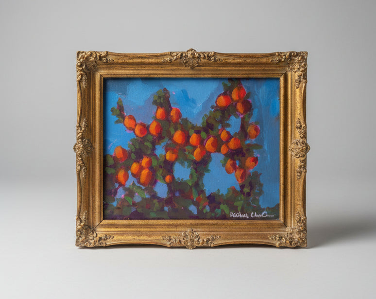 orange tree painting in gold frame