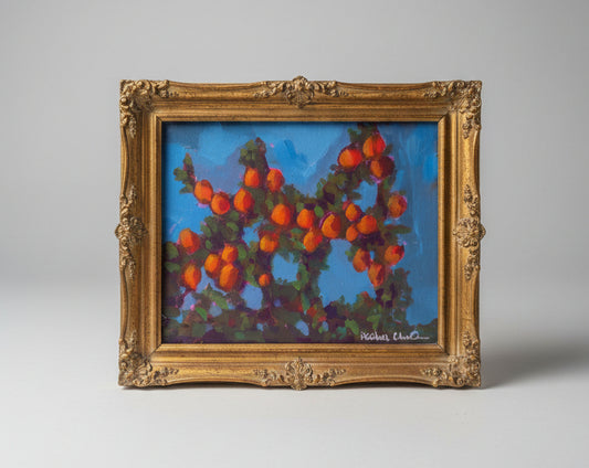 orange tree painting in gold frame