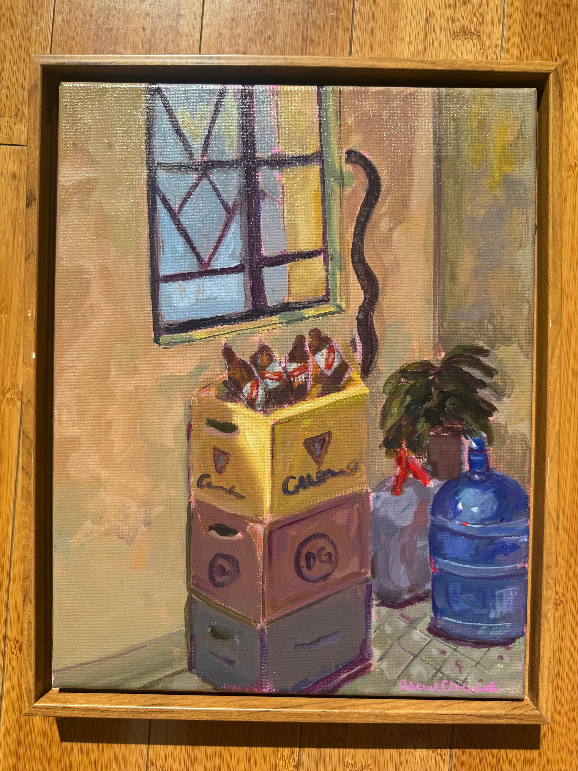painting of crates on a floor with a window and water bottle framed the painting is on a wooden background
