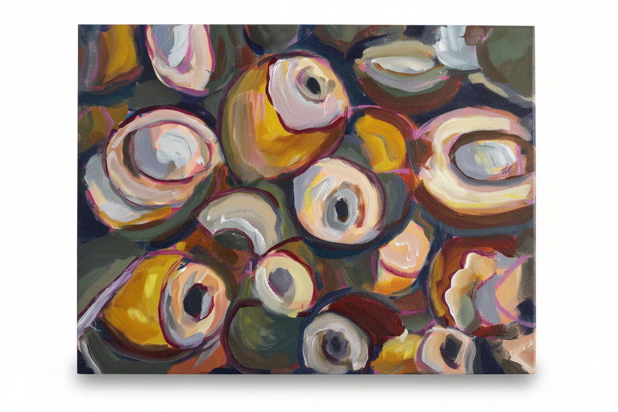 Abstract painting with colorful circular shapes held by a hand.