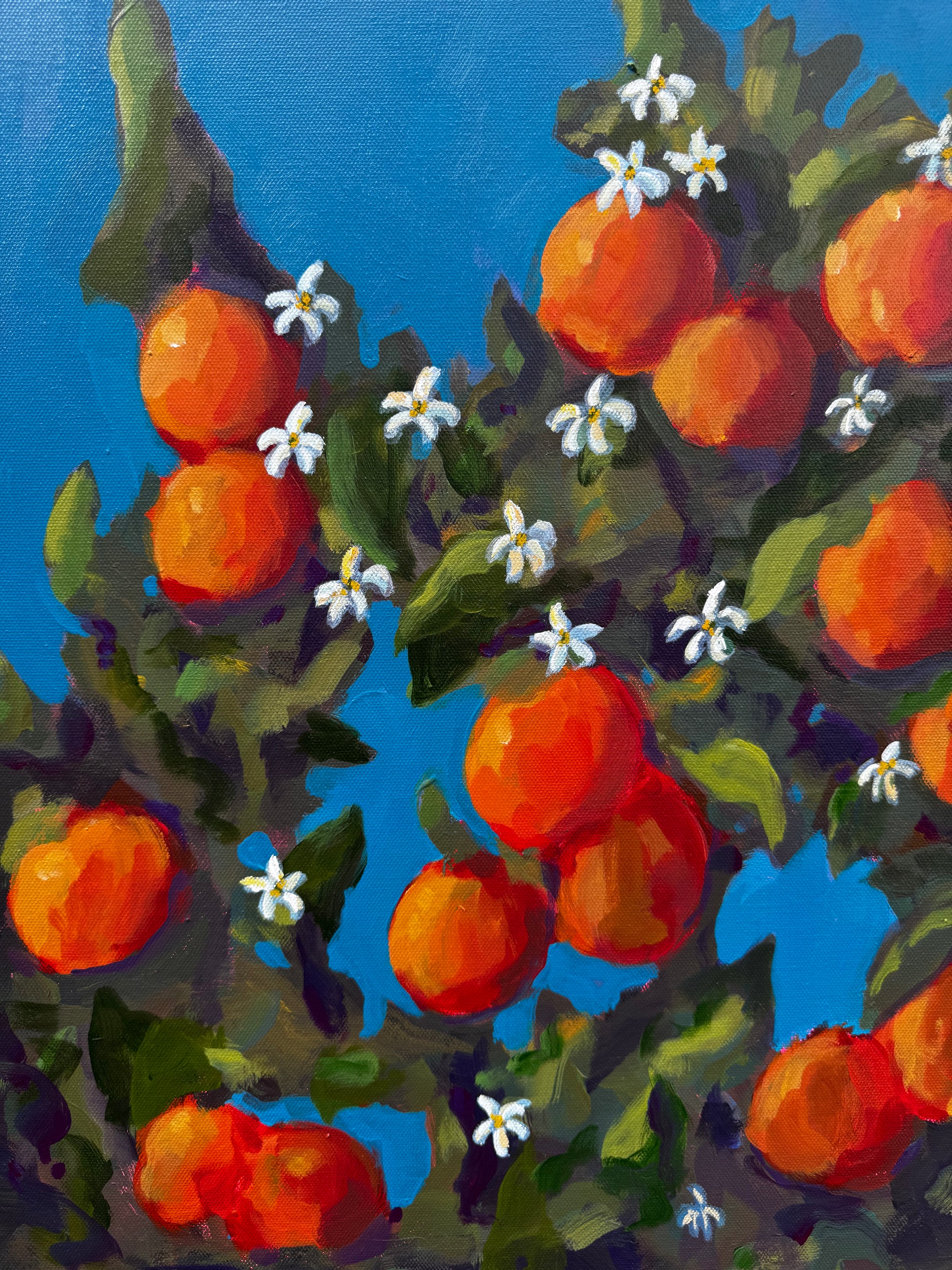 Painting of a branch with oranges and flowers against a blue background