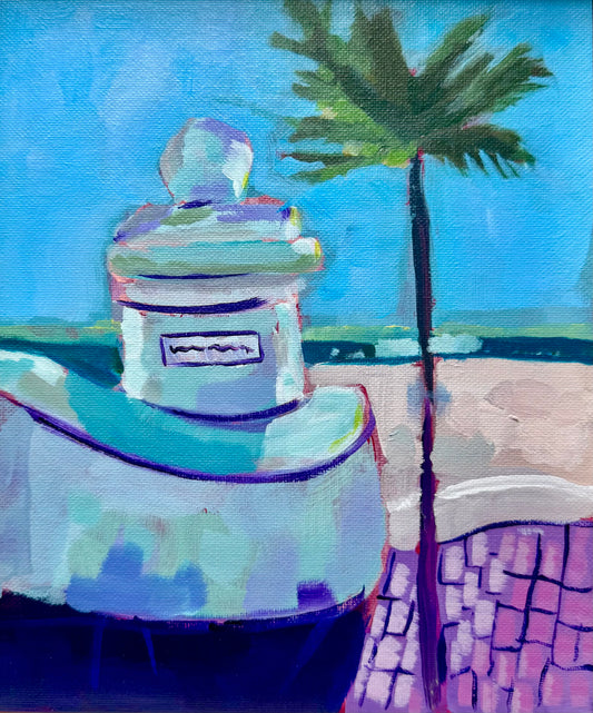 Decorative urn with a palm tree and blue sky in the background