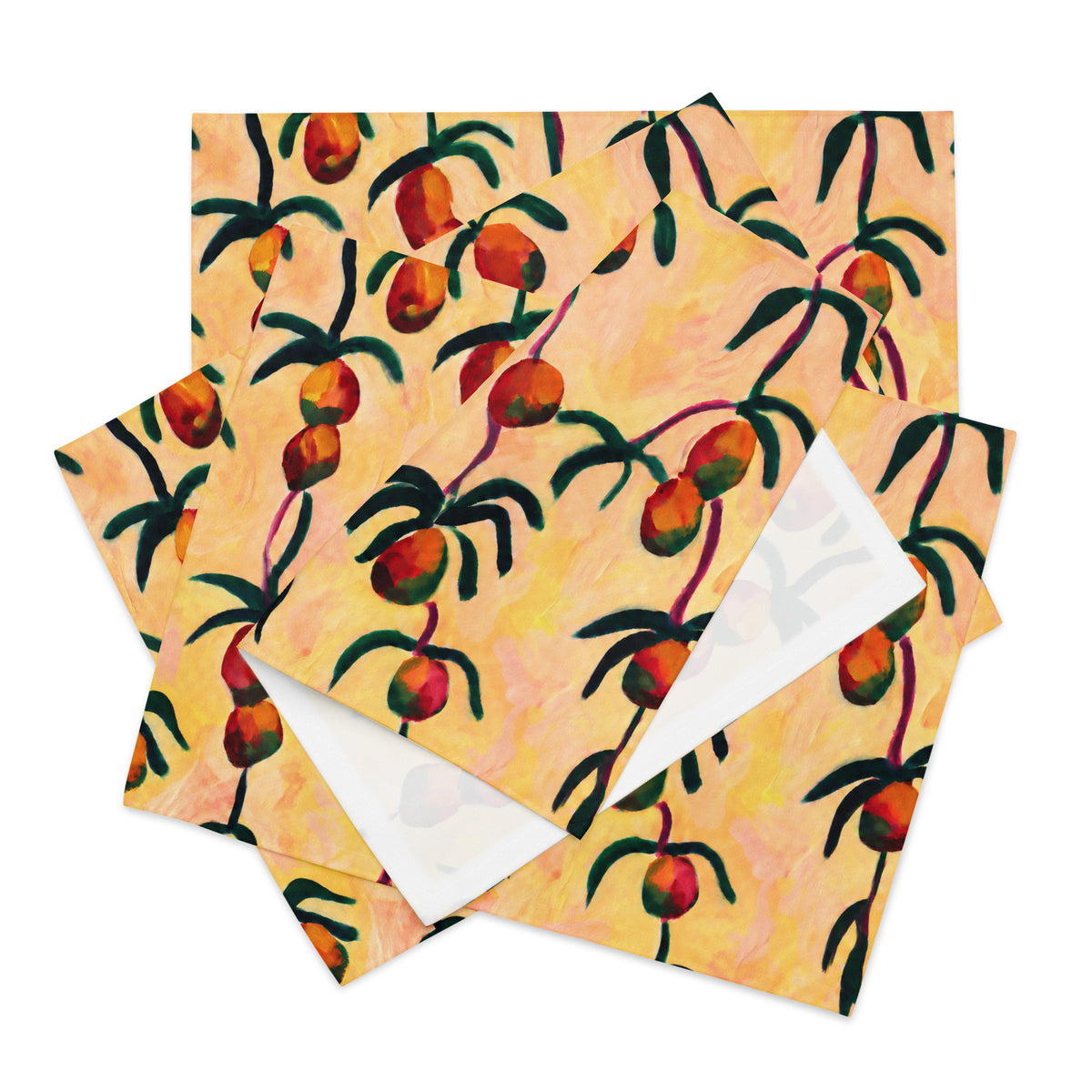 A stack of square patterned papers or napkins featuring a painted design of hanging red and orange fruits with dark green leaves on a warm peach background, with one sheet slightly offset to show a white reverse side.