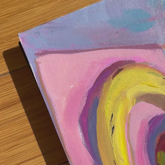 Video of fruit painting colorful - banana, strawberry and pear on pink and blue. Video shows wood background. 