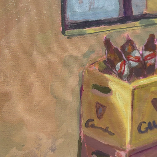 video of painting of crates on a floor with a window and water bottle framed the painting is on a wooden background